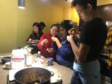 A bunch of students making dumplings