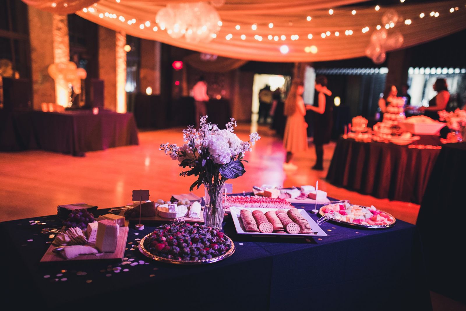 The food and snacks at the Ezra Gala with flowers in the center of the table