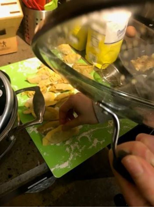 Final touches on a batch of dumplings