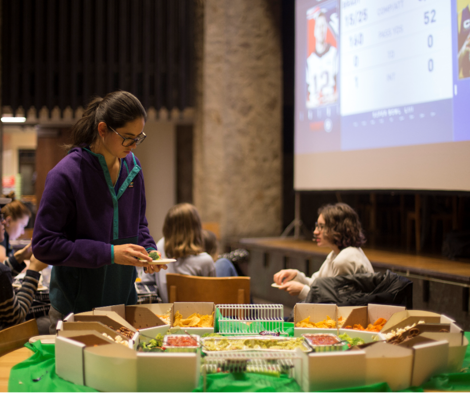 students getting finger food for the 2019 super bowl