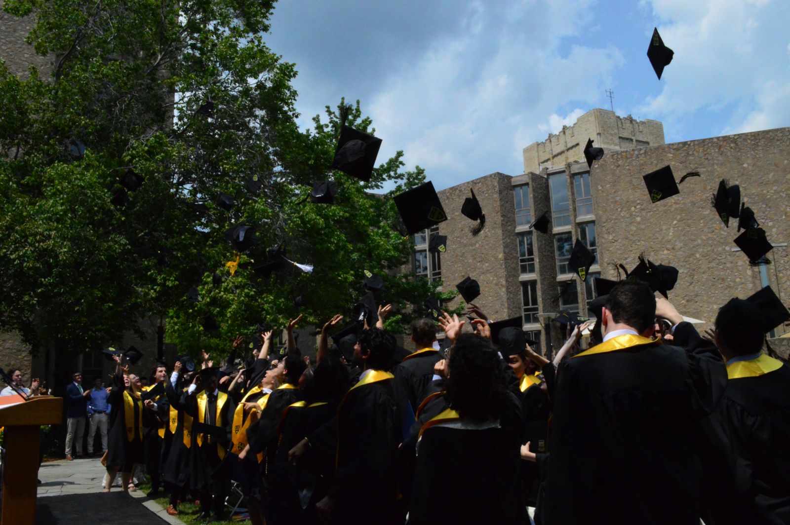 Ezra Stiles Class of 2023 through their caps to the air in celebration of their commencement