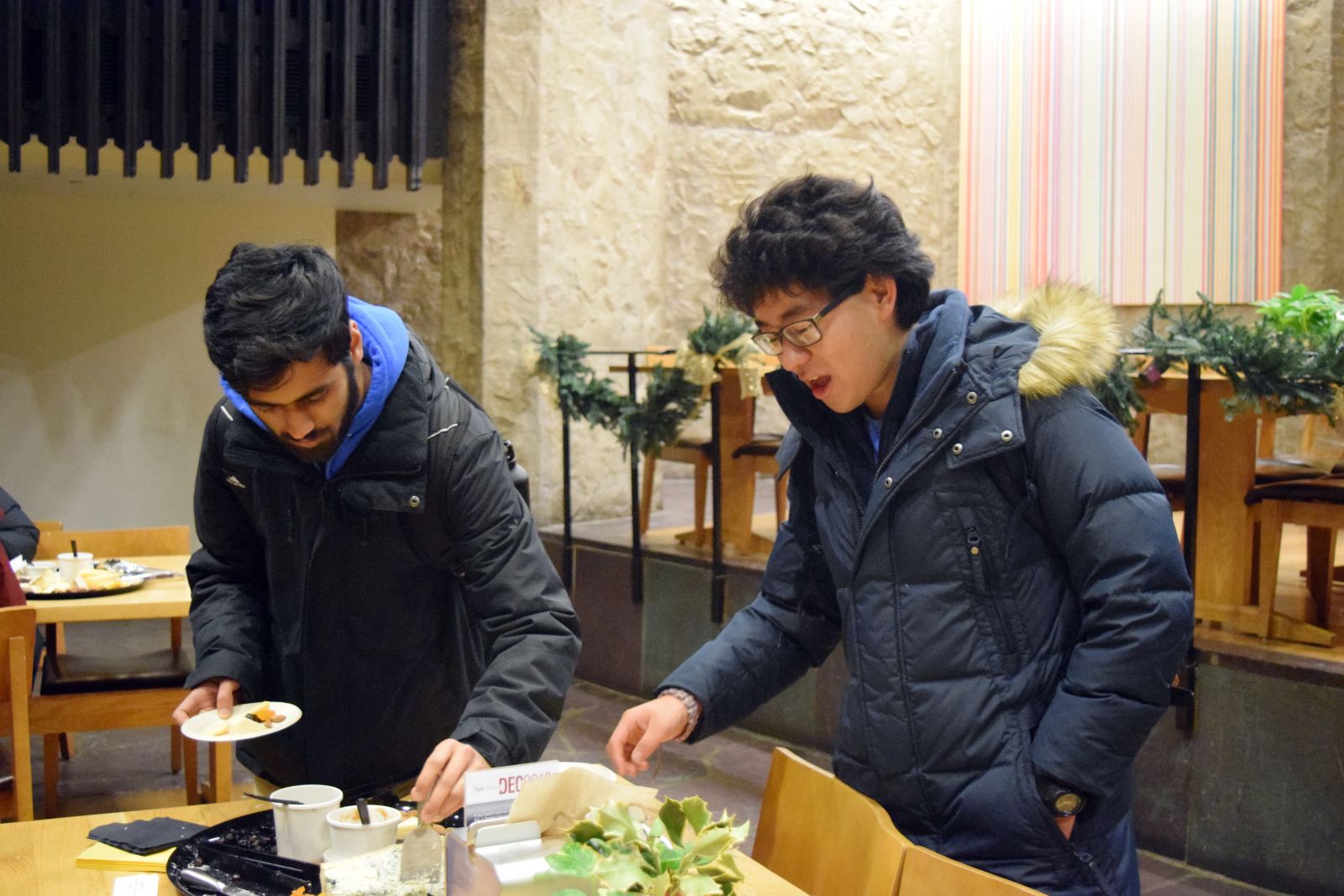 2 Yale students picking cheese