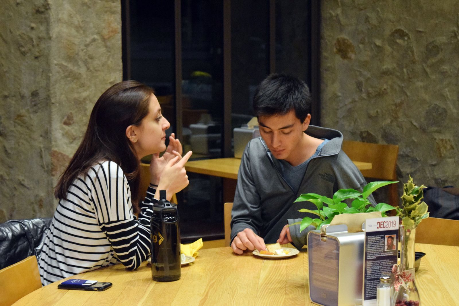 Yale students tasting cheese and having conversation as a study break
