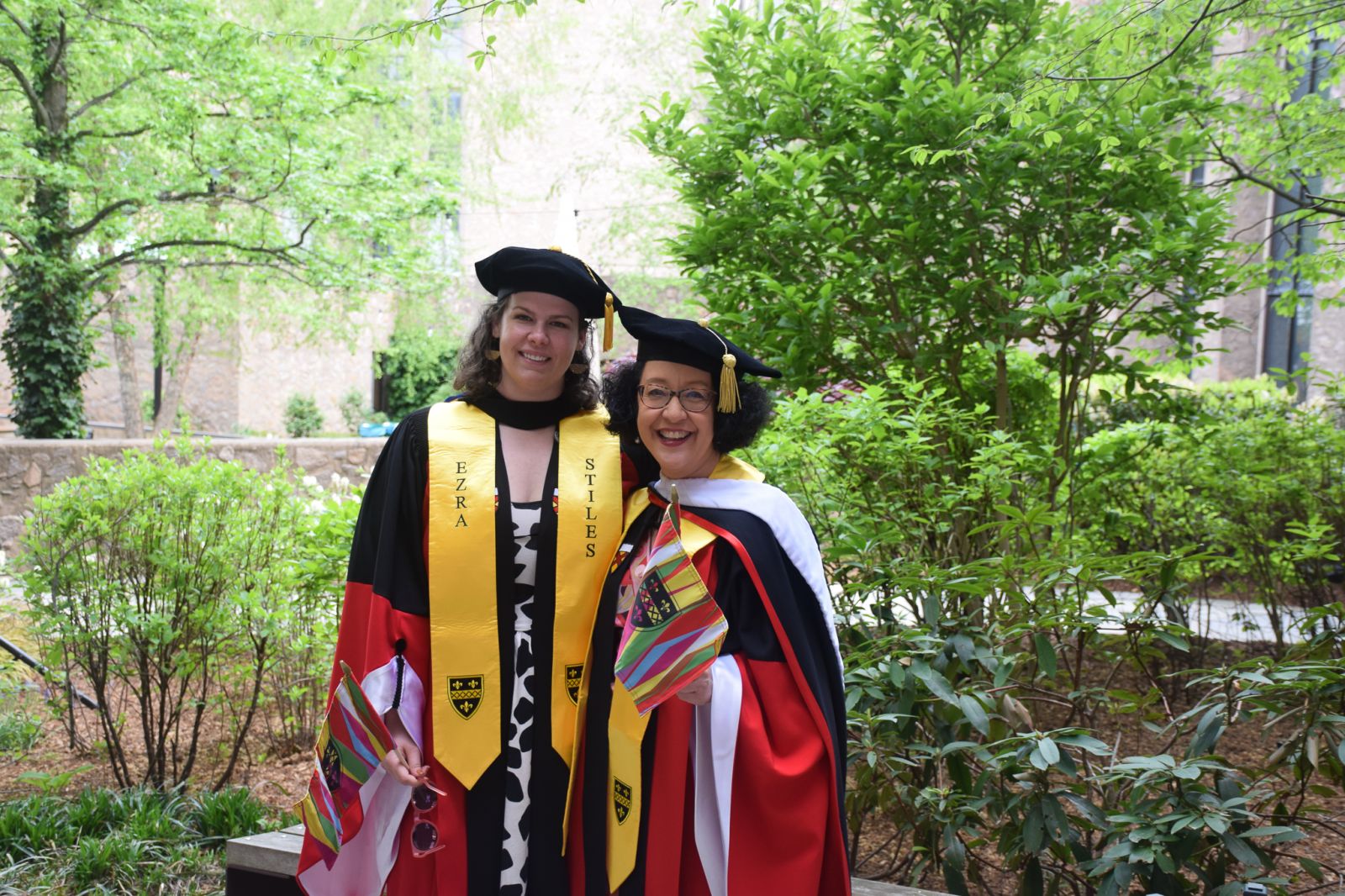 The commencement speaker with the dean of college