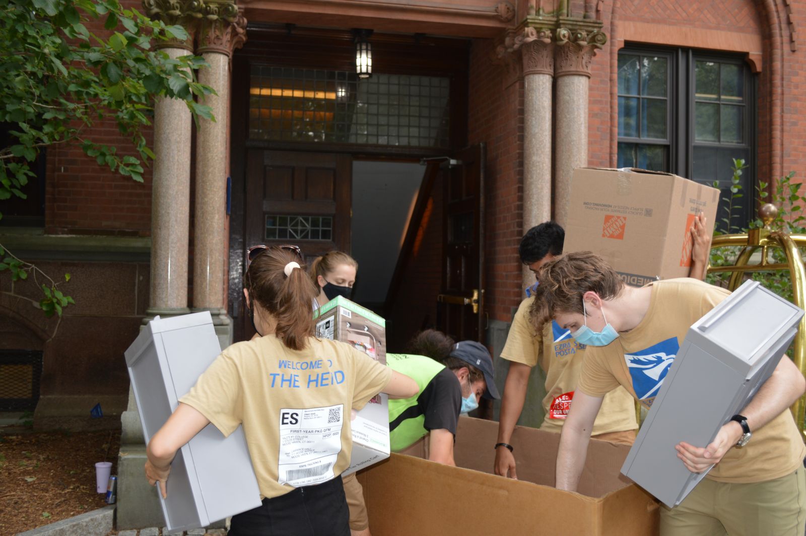 Fall move in volunteers classifying items during move in day