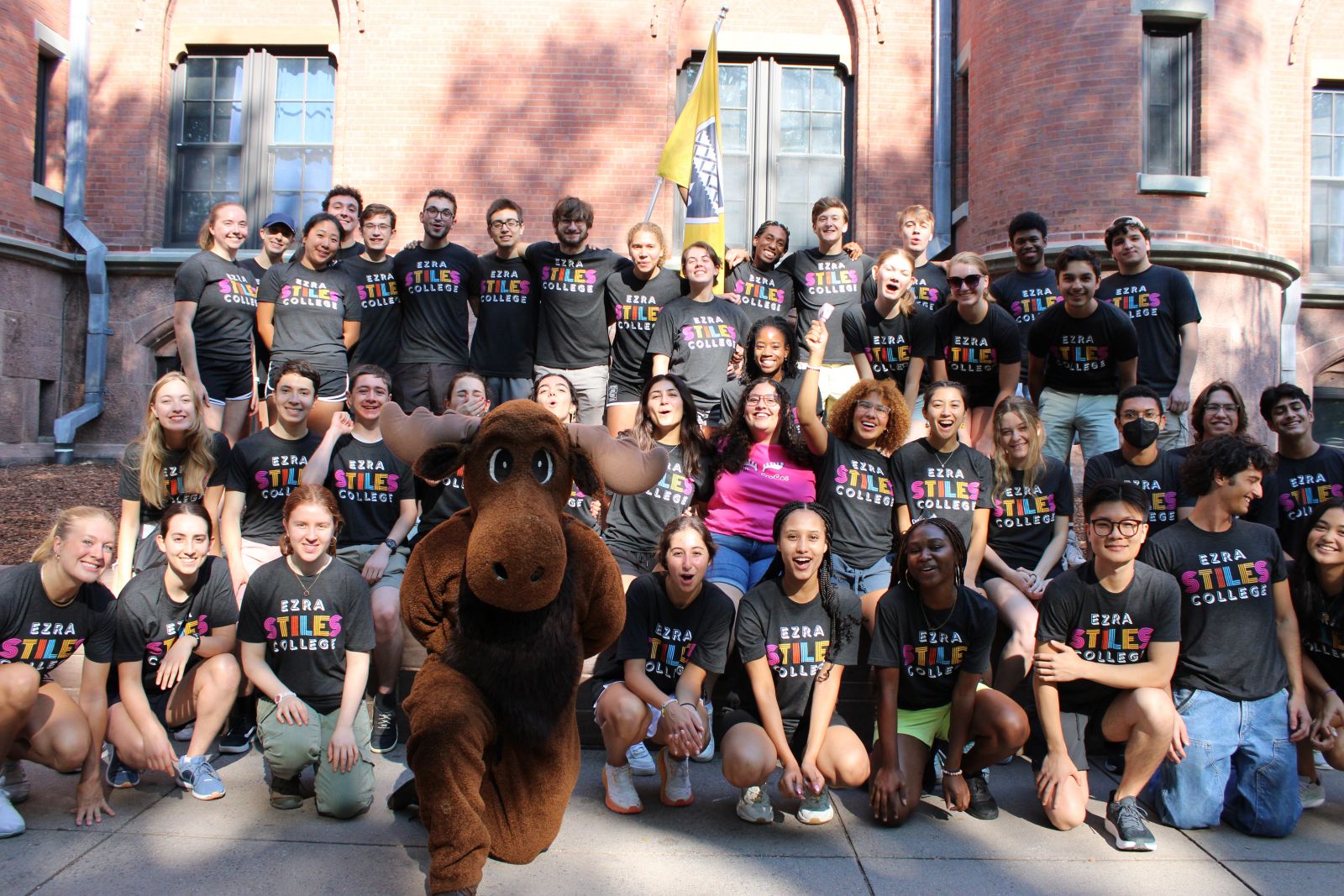 Ezra Stiles Move-in volunteers take group photo with the Moose mascot