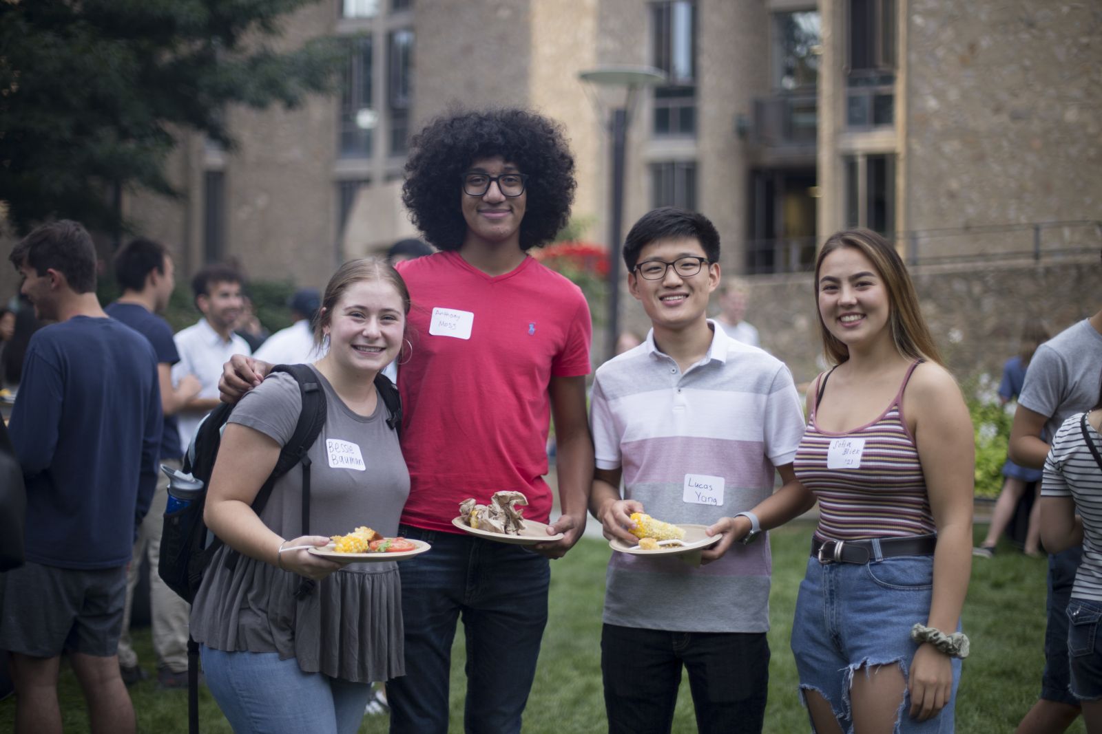 4 yale students enjoying the food at the cookout