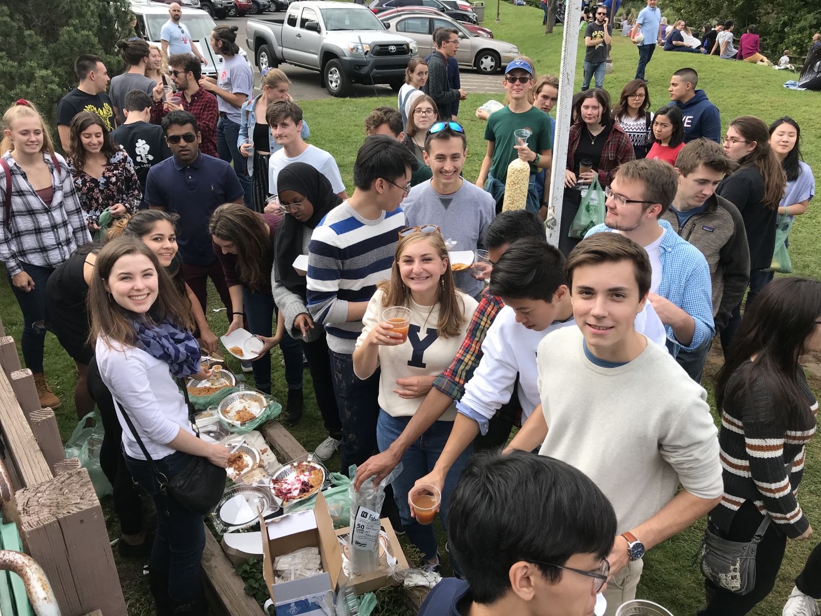 Many Stilesians eating apples at the orchard