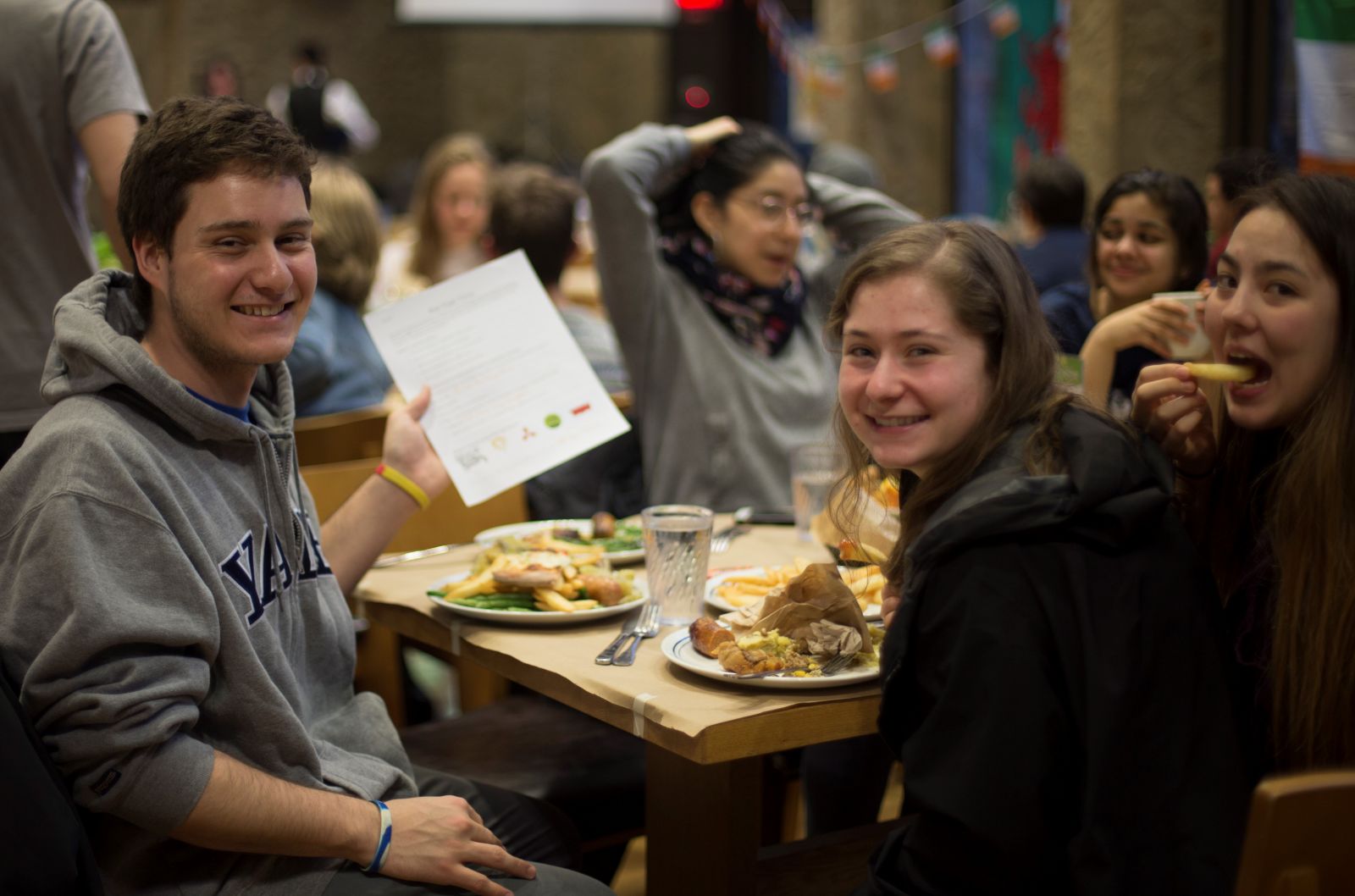 Students enjoying their british food at pub night