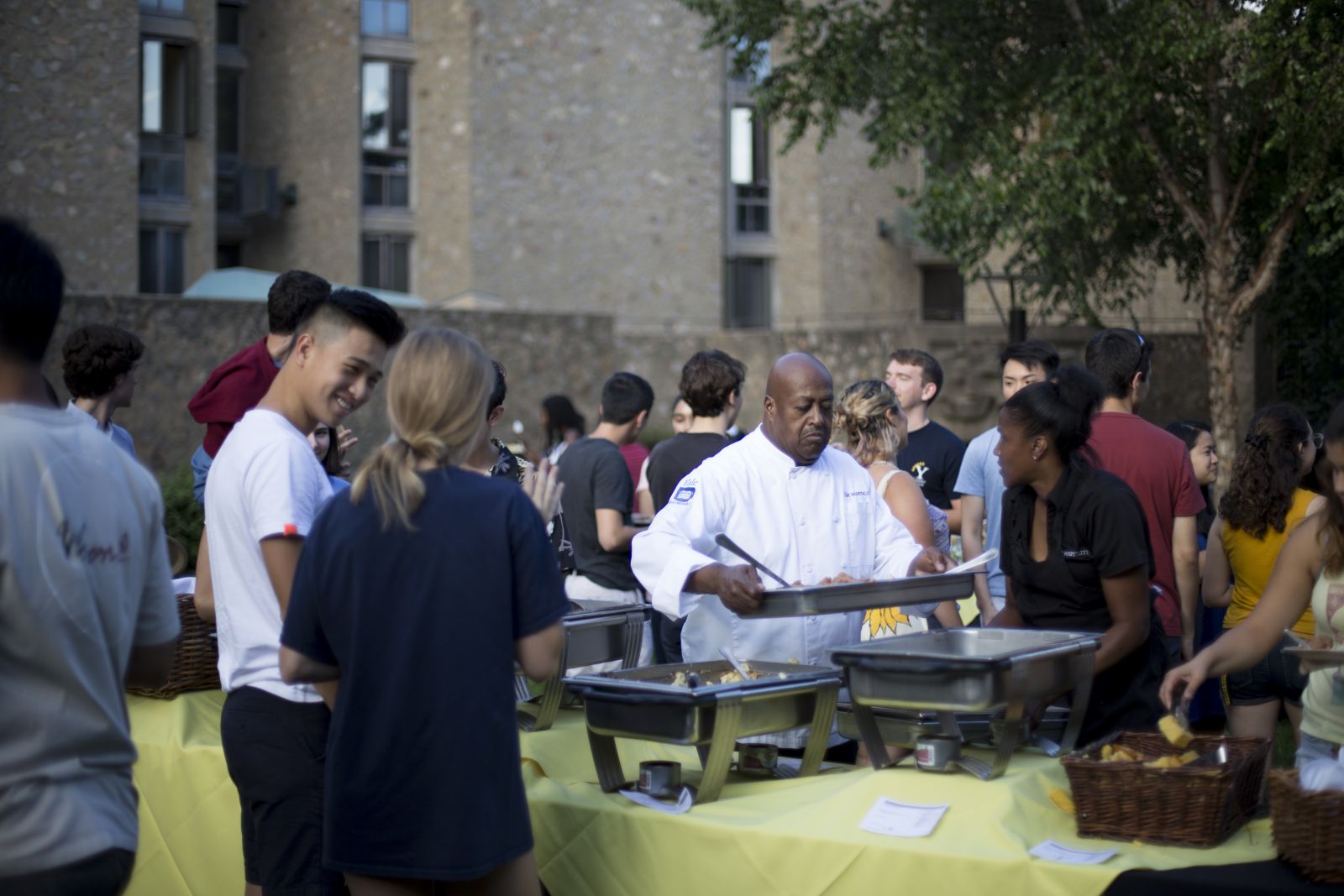 First-year students getting food and chatting with new friends
