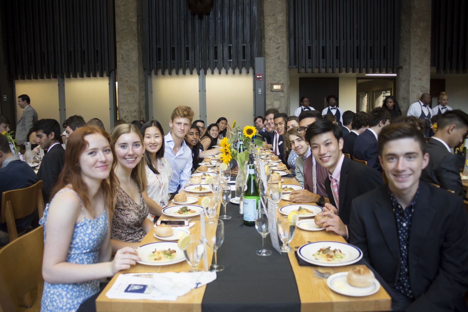 A table full of first-year students having their first-year dinner