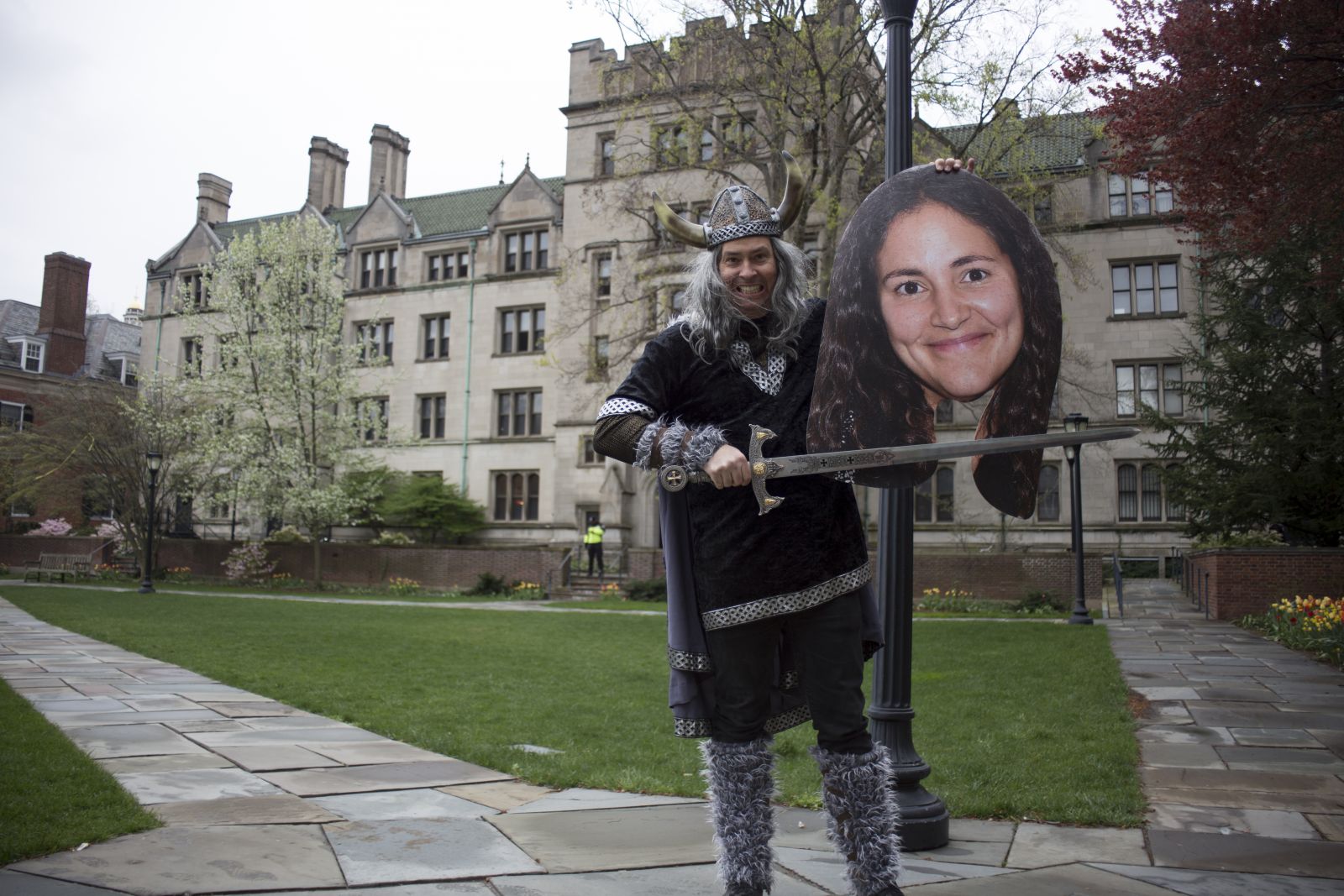 Yale student dressed as a viking with someone's head cutout