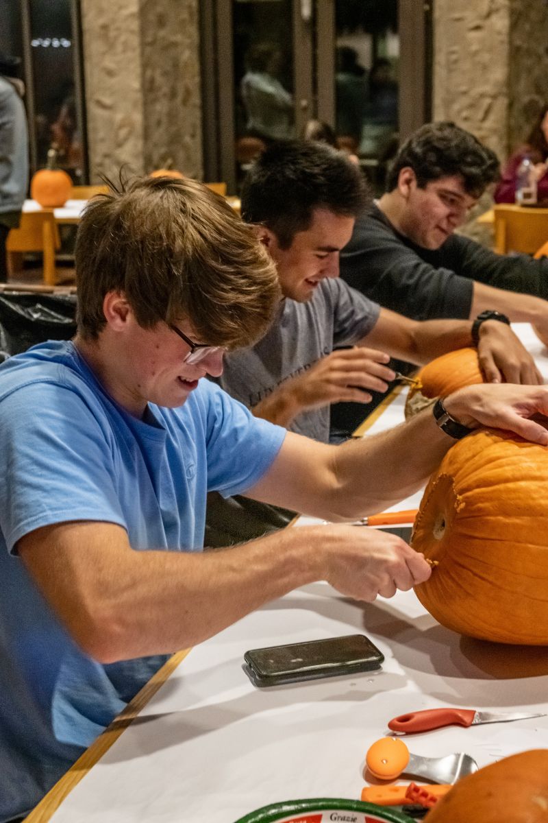 Pumpkin carving 3 guys