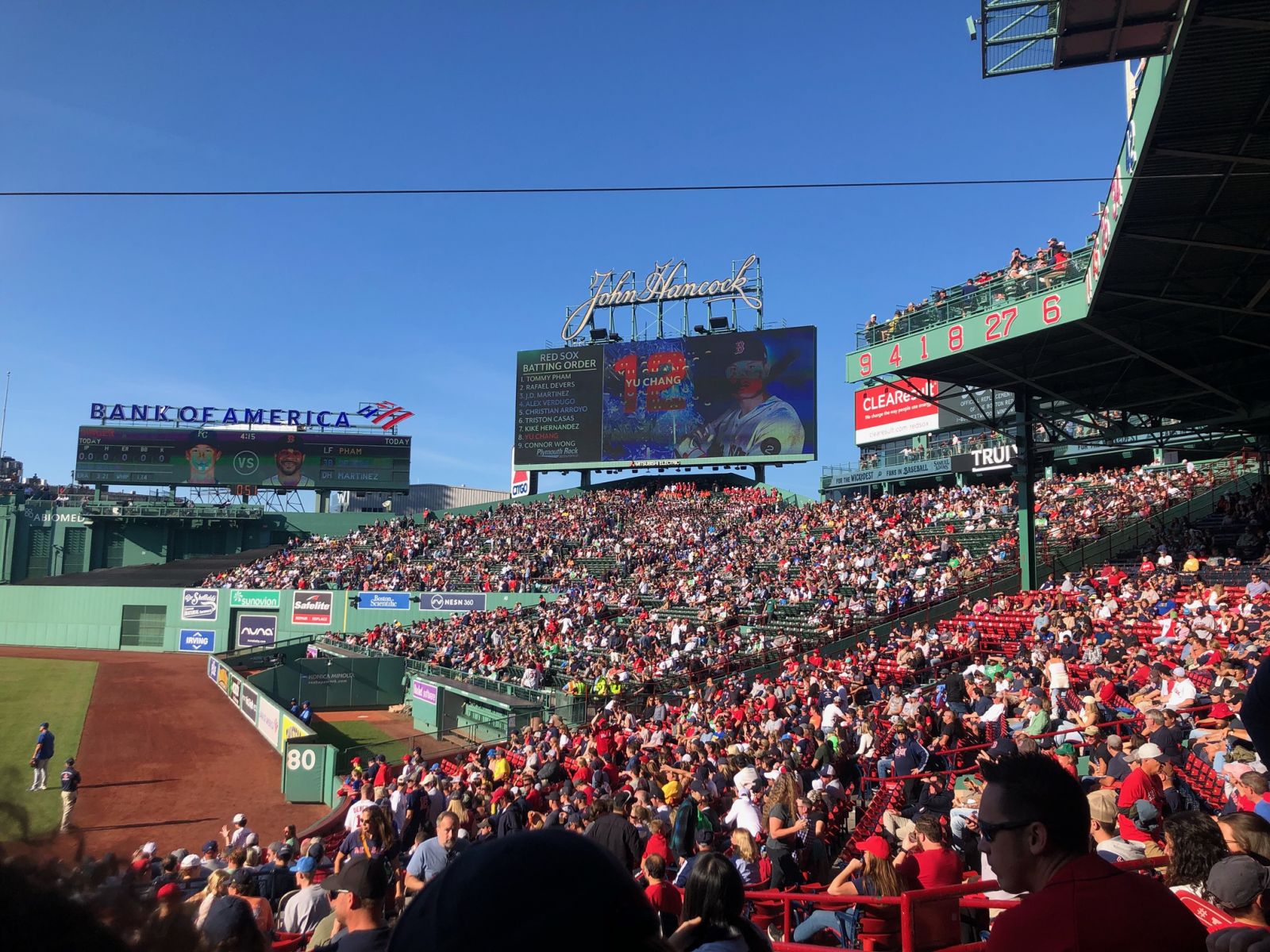 A full stadium of baseball fans at Fenway Park watching the Boston Red Sox