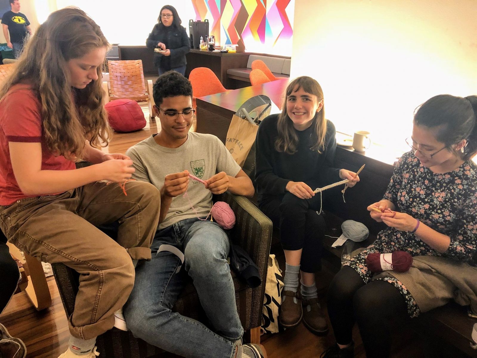 Group of friends knitting together