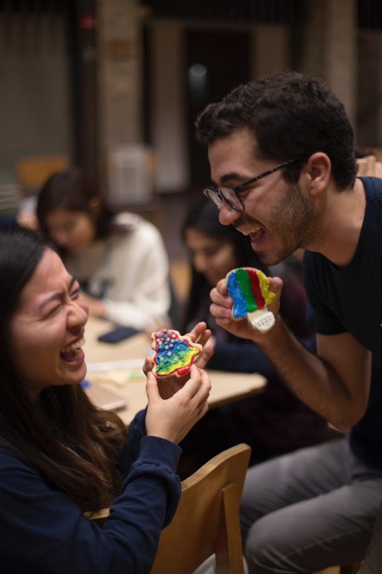 2 students show off their matching cookies