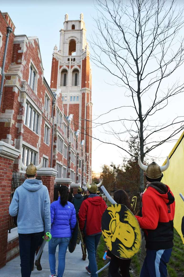 Students wearing viking helmets head on to raid another college