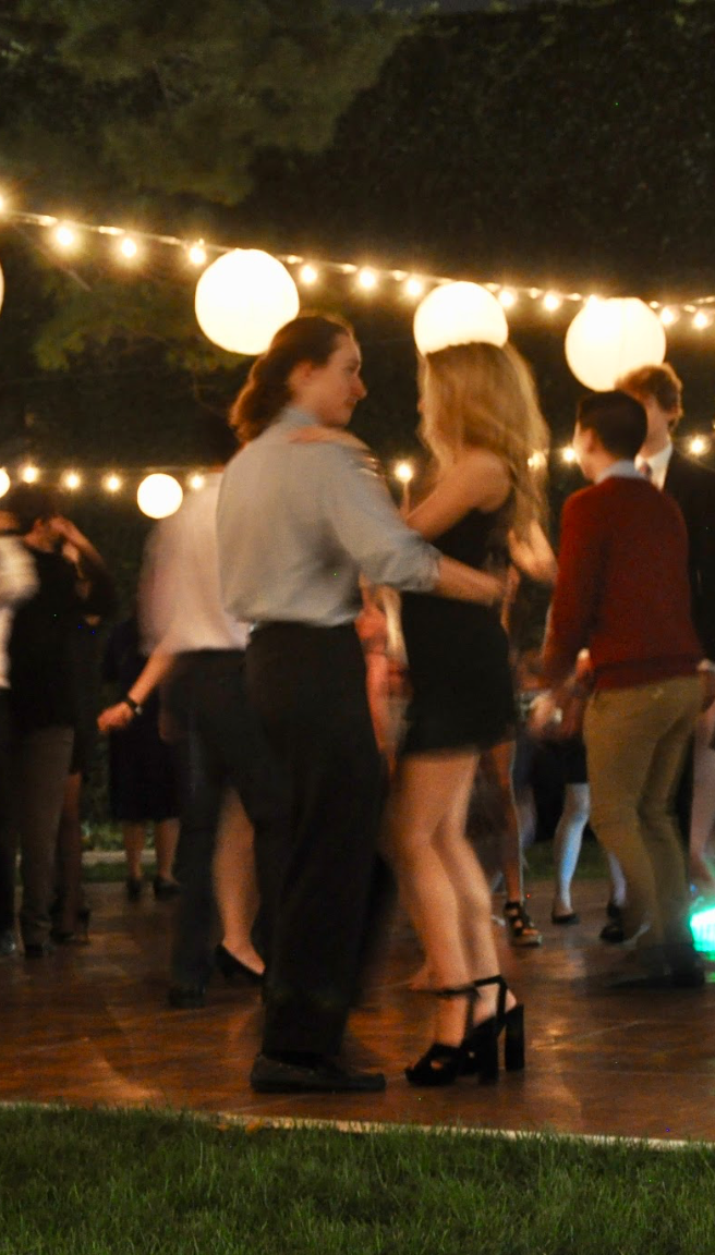 Students slow dancing on the dance floor