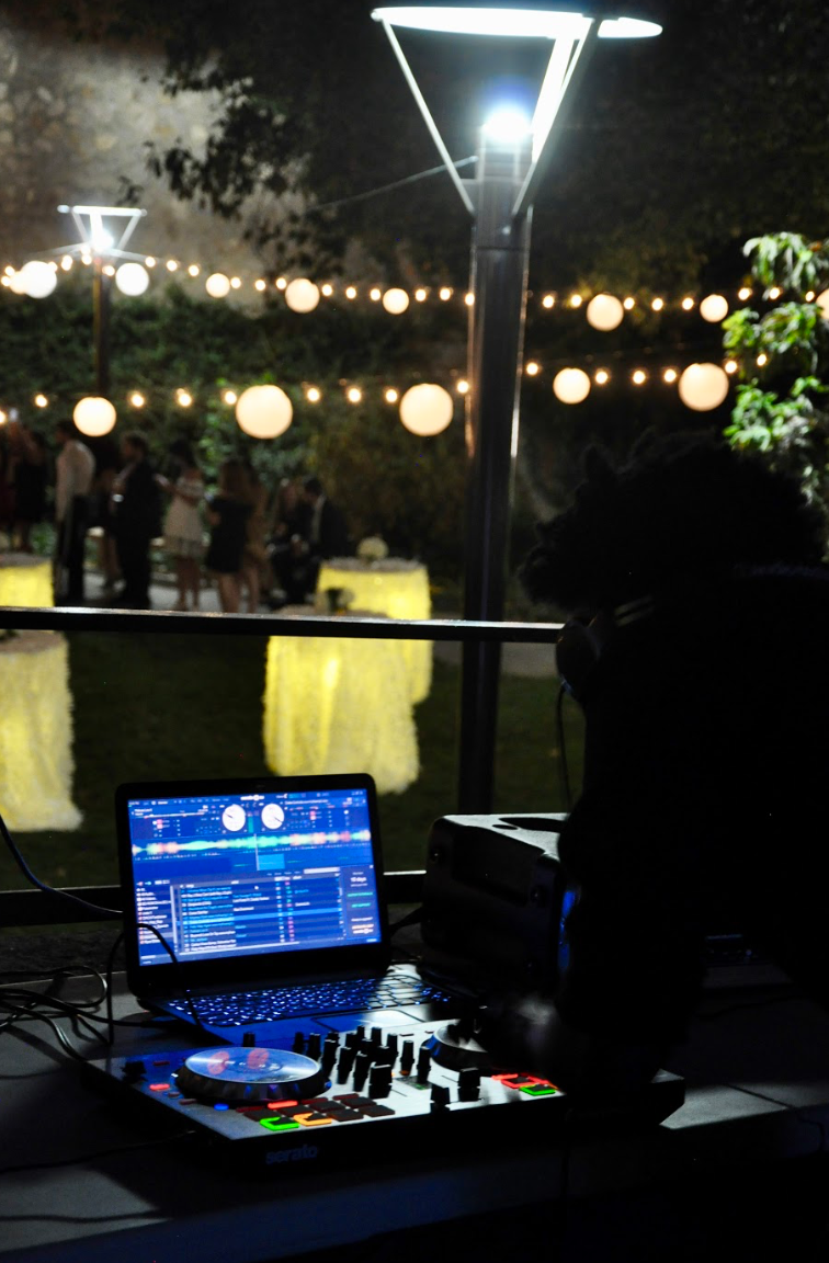 The DJ with their equipment on the courtyard