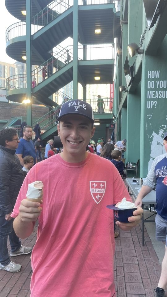Sam enjoying snacks at the baseball game