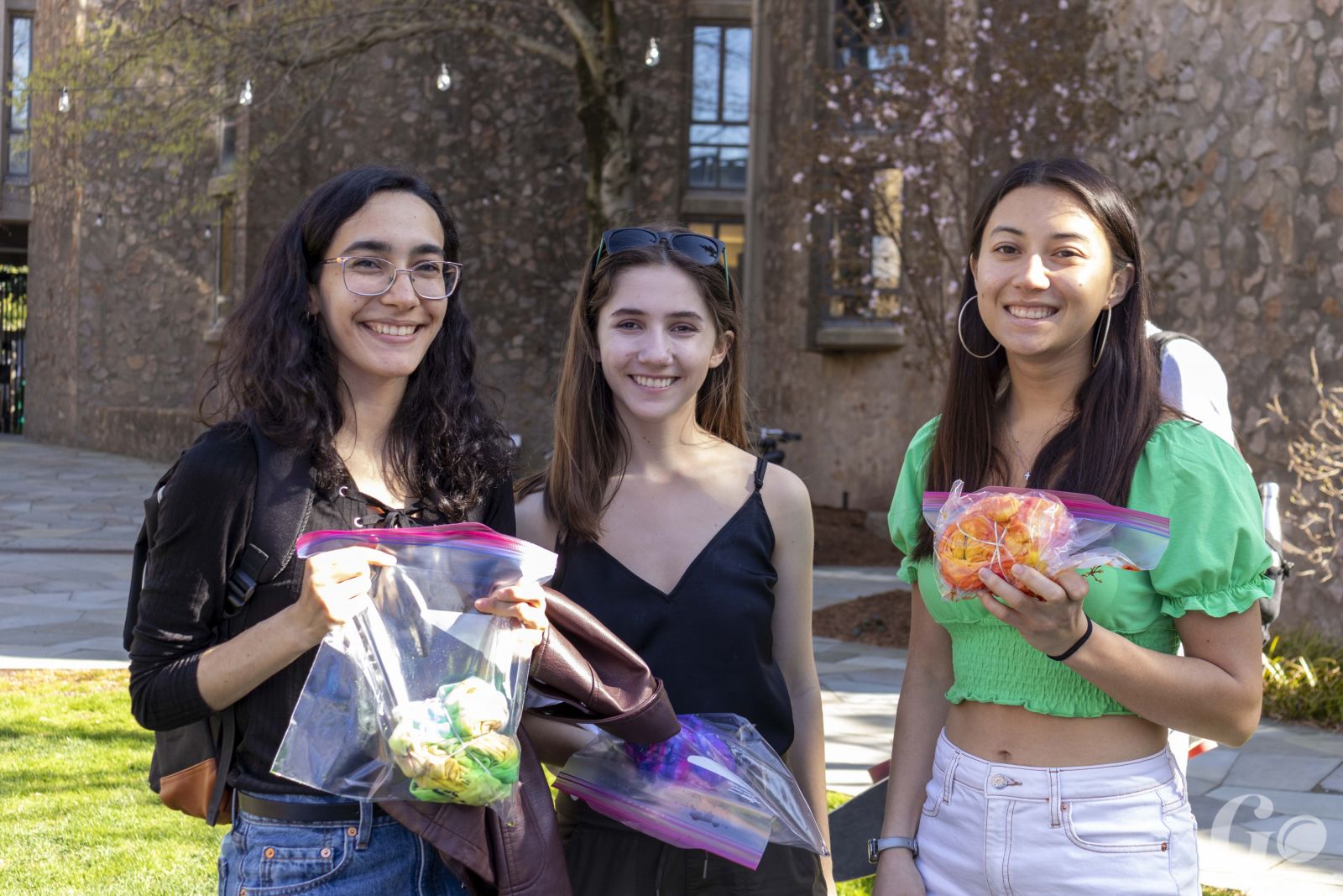 group of Stilesians showing off their tie-dyed shirts in green, purple, and orange