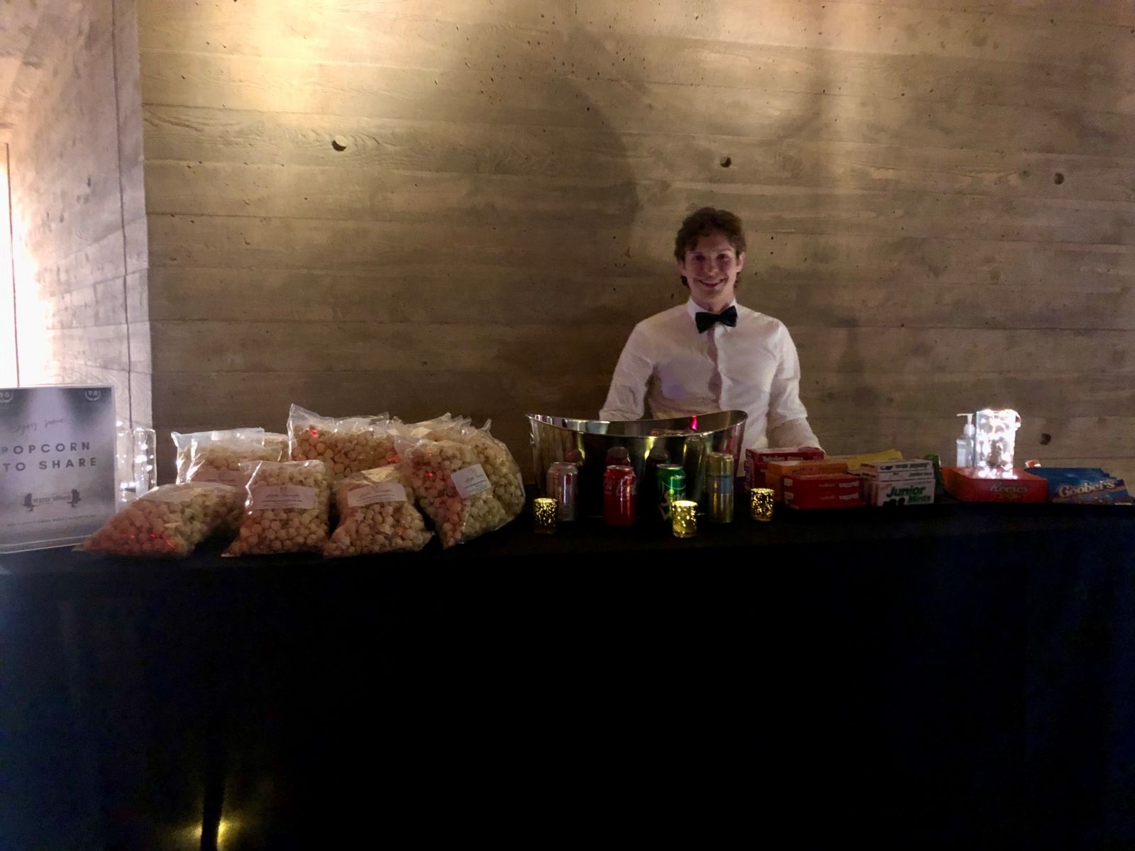 A staff worker providing popcorn, drinks and other snacks for the film festival