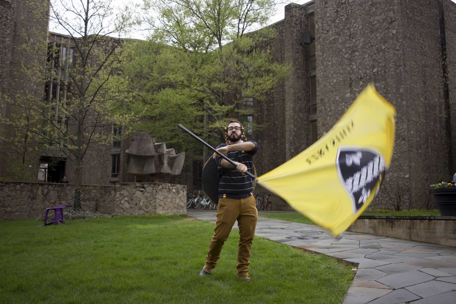 Yale Student spins around Ezra Stiles flag