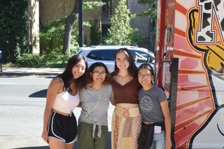 A group of students from the class of 2025 standing next to an ice cream truck