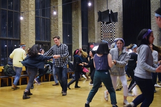 Yale students contra dancing in the dining hall