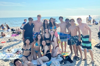 The Herd posing at the beach sand