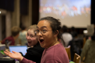 students enjoy watching the 2019 superbowl at the watch party