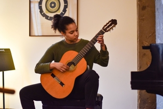 Arts week 2023 playing classical guitar