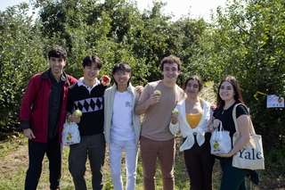 Group of 6 eating apples for the photo