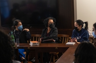 Limon holding a discussion at the Fellow Lounge