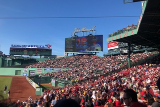 A full stadium of baseball fans at Fenway Park watching the Boston Red Sox