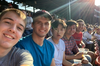 Stilesians taking a group selfie at Fenway Park's seats