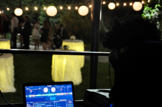 The DJ with their equipment on the courtyard