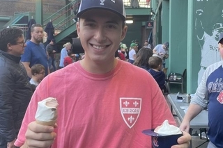 Sam enjoying snacks at the baseball game