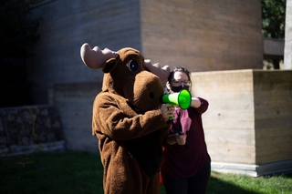 The Moose mascot speaking on the speakerphone