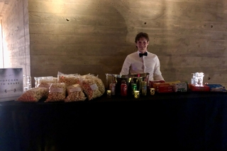 A staff worker providing popcorn, drinks and other snacks for the film festival