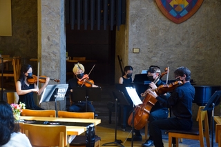Yale students from a band playing music