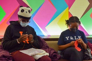 2 yale students knitting at the common room